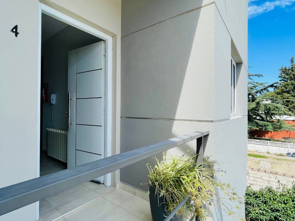 Door of apartment 4 on the outdoor walkway