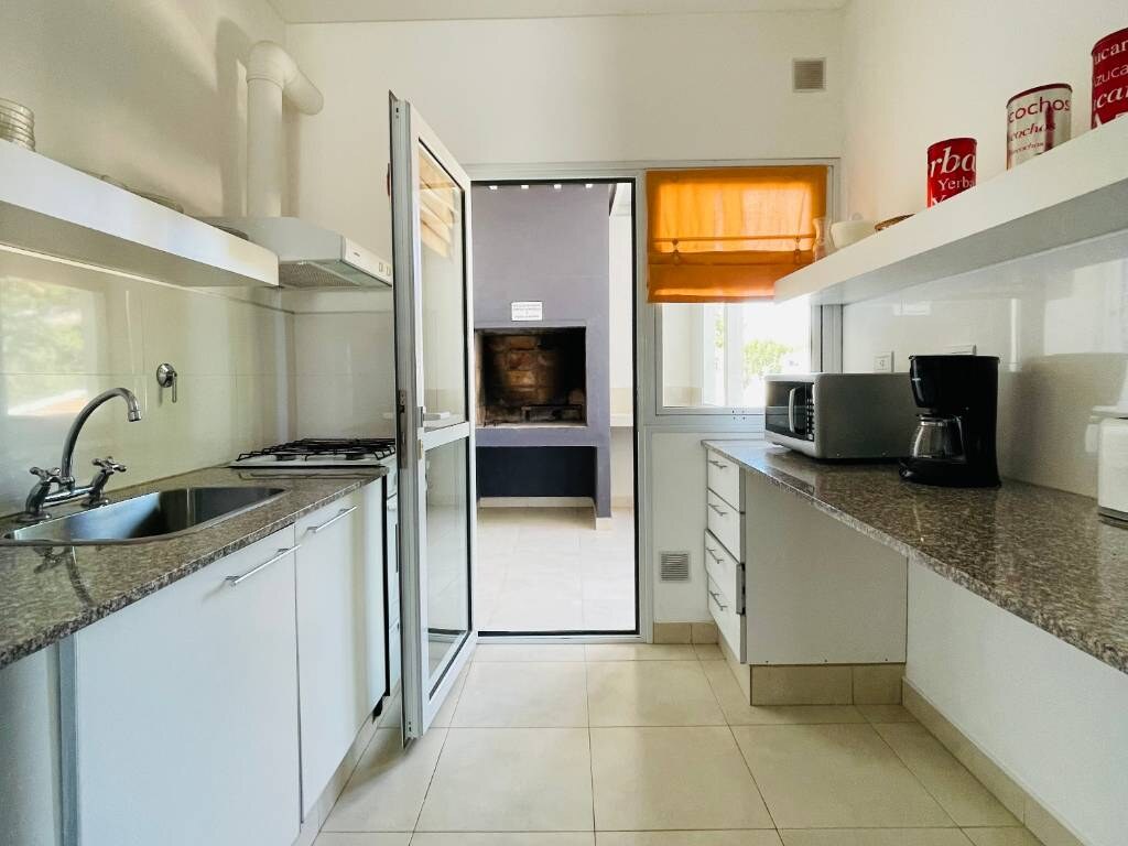 Kitchen with glass door to the barbecue grill