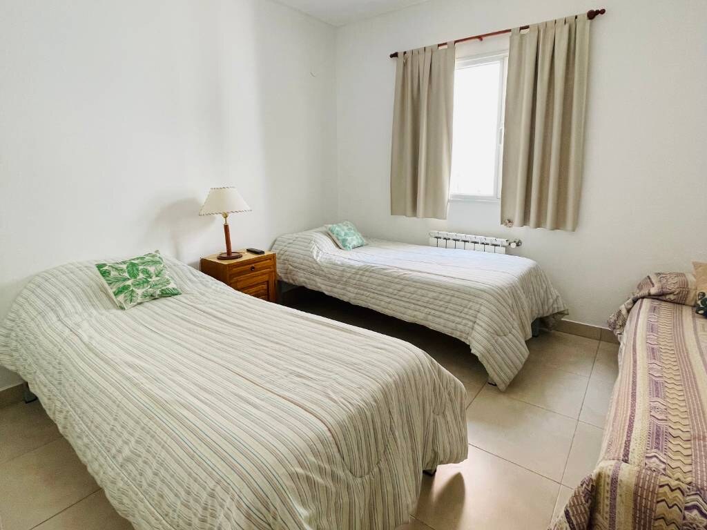 Bedroom with a double bed and a single bed