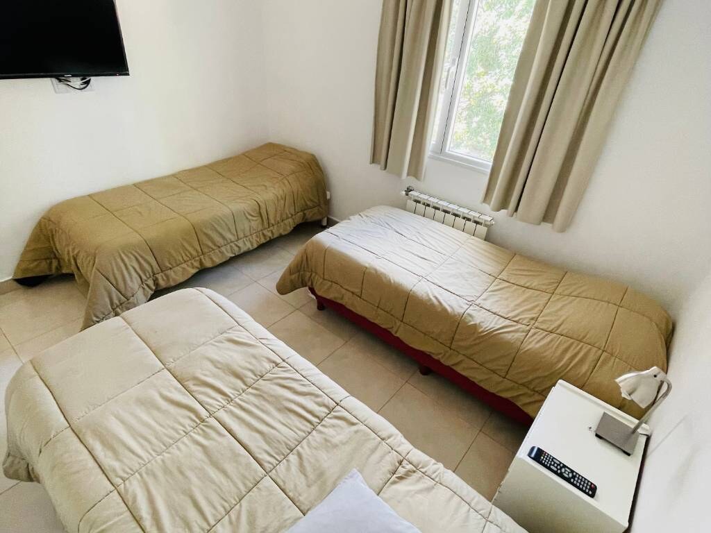 Bedroom with three single beds