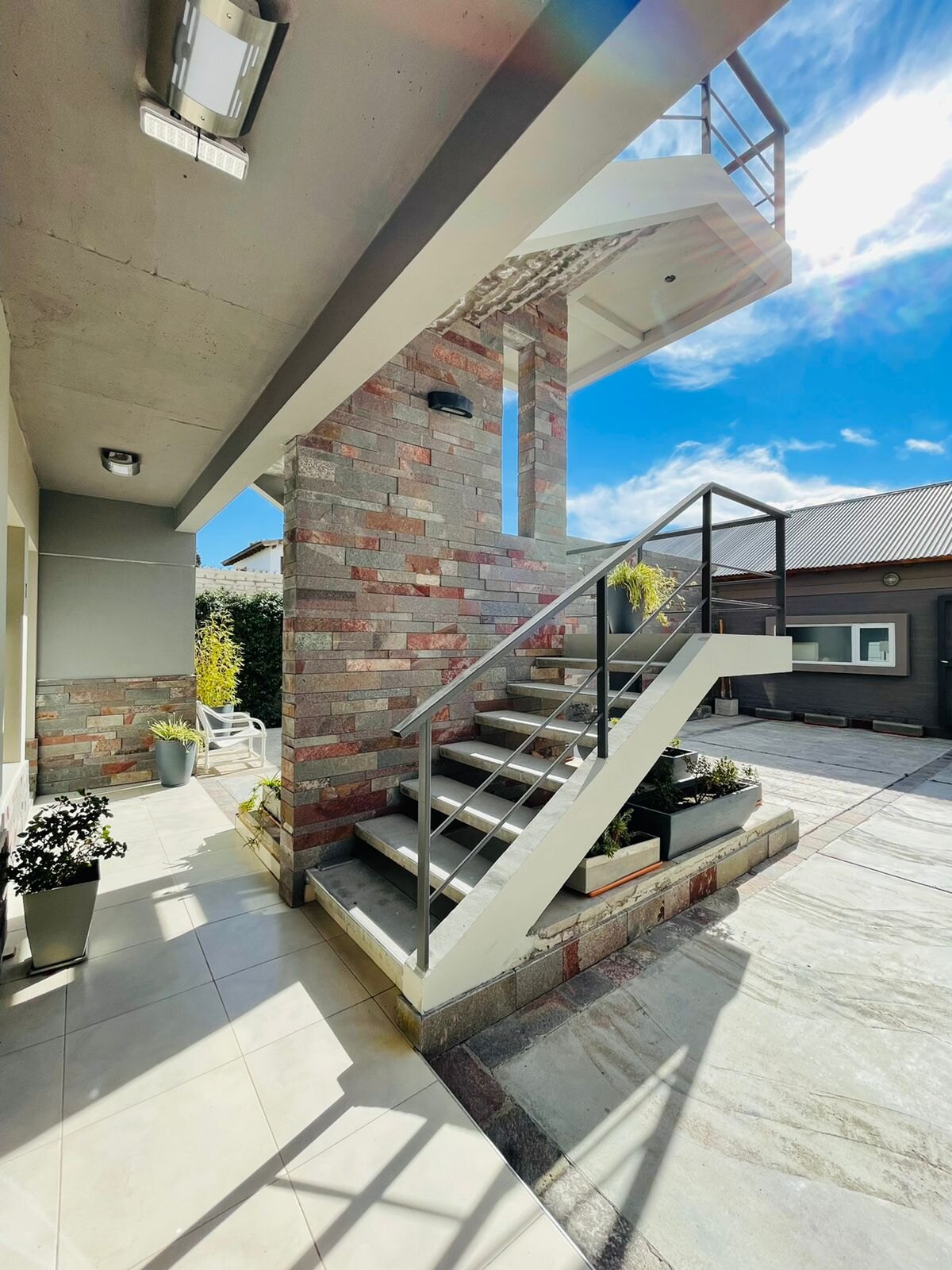 Outdoor staircase and front of the building on a sunny day